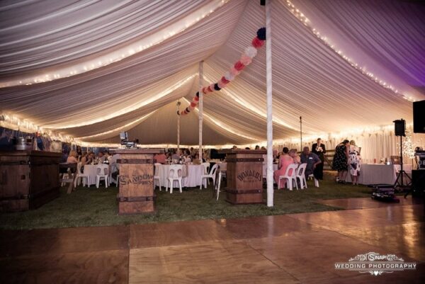 Marquee Hire at Ashburton event showing silk lining and fairy lights and dance flooring